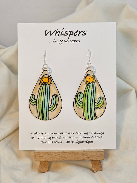 Abstract Sun and Cactus hand painted watercolor paper earrings. Ultra lightweight. Tans and Muted greens. Black painted edge detail. Back is painted with similar colors and design. Tear drop in shape. Resin coating for durability. Double Jump ring detail. Sterling silver findings. Hangs 2 1/4" in length