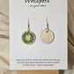 Holiday Wreath Hand Painted Wood Earrings. 1" Stained wood round, two toned Holiday wreath painted with white and colored berries. Ultra light weight. Back of earring is stained natural. Enameled for durability. 14kg over sterling ear wires and findings. Hangs 1 1/4"