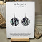Roots Nature Inspired Hand Painted Paper Earrings. Ultra lightweight 1 1/4" Circle. Black washed roots a top a blue grey washed background. Back is painted in complimentary colors and design. Resin coating for durability. Sterling silver ear wires and findings. Hangs 1 1/2" length