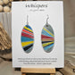 Colorful Retro Sunburst Hand Painted Wood Earrings. Multicolored geometric sunburst painted in acrylics. Back is painted in similar colors and pattern. Enameled for durability. 2" Elongated wood oval. Sterling silver mixed metals with sterling silver findings and hangs 2 1/4" in length
