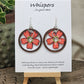 Hawaiian Plumeria Hand Painted/Crafted Earrings. These gorgeous one of a kind Statement earrings are hand painted wooden flower die cut in coral. green and white and have the same design on both sides. Sterling Silver Ear wires and large findings. Large dark stained wood circle encompasses the piece. Enameled for durability. Hangs 2" Ultra light weight