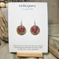 5 Poppies Hand Painted Wood Earrings Stained. 1" wood round, painted with pinkish red bunch of poppies. Ultra light weight. Back of earring is painted in same design. Enameled for durability. Acrylic ear wires, for metal sensitive ear lobes. Hangs 1 1/4"