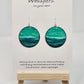Aqua Blue and teal hand painted paper earrings. Done in watercolor. Impressionistic ocean scape. Circular in shape. Back of earring is painted to match. Ultra lightweight. Resin coated for durability. 1 1/2 in diameter. Sterling findings. Hangs 1 3/4" in length