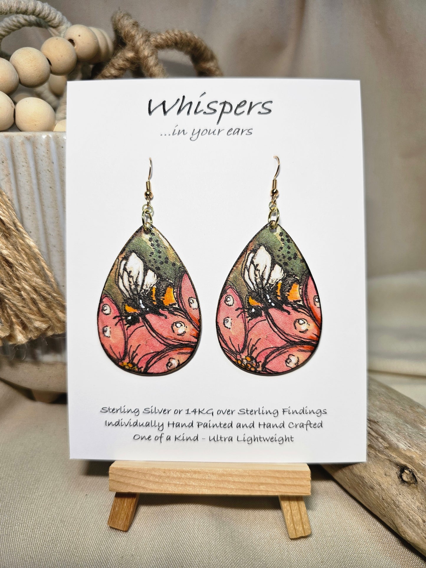 Bee-U-tiful Art Print Wood Earrings. Artwork by Lee M. Hein. 2" Tear drop. Watercolor image of Bumble Bee on a pink flower in tree. Back is painted with light brown wash. Enameled for durability. 14kg over Sterling silver findings. Hangs 2 1/4" in length
