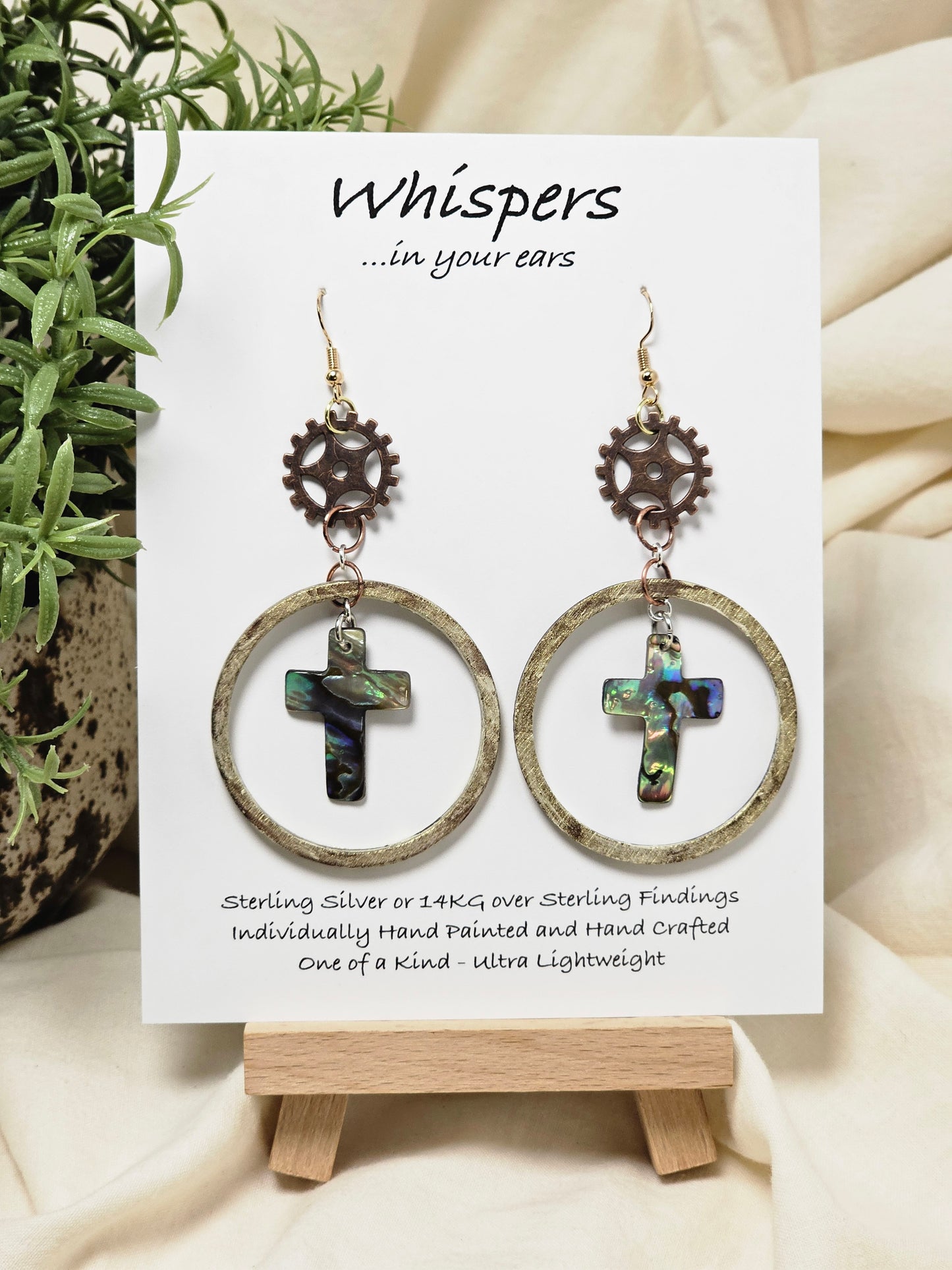Bronze and Abalone Cross Hand Painted/Crafted Earrings. These gorgeous one of a kind Statement earrings are 14kg Ear wires mixed metal findings. Brass watch gears adorn hand distressed wood circle with abalone crosses. Enameled for durability. Hangs 2 3/4"Ultra light weight