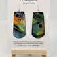 Colorful Fluid Wash Hand Painted Statement Paper Earrings. Large 2 3/4" elongated rectangle with rounded edge. Blues, oranges and black in color. Back is painted in similar design. Edged in black. Resin coated for durability. Ultra light weight. Sterling silver ear wires and findings. Hangs 3"