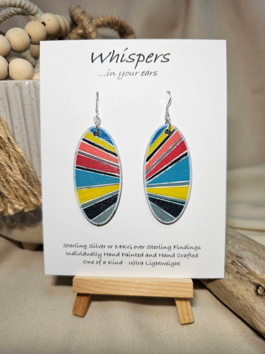 Colorful Retro Sunburst Hand Painted Wood Earrings. Multicolored geometric sunburst painted in acrylics. Back is painted in similar colors and pattern. Enameled for durability. 2" Elongated wood oval. Sterling silver mixed metals with sterling silver findings and hangs 2 1/4" in length
