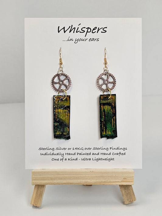 Copper Steampunk Hand Painted Paper and Wood Earrings. 1/2" x 1 5/8" Paper Rectangle hand painted brightly colored background with silver and copper accents. Edged in black. Hanging from Copper notched circular gear.  Back is painted to match. Resin coating for durability. Sterling Silver findings. Hangs 2 1/2" in length