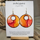 Crimson Tide Hand painted watercolor ultra lightweight paper earrings. 2" circle Waves of red, peach , pink and brown on white background. Dark brown detail painted edge. Back is painted with similar color and design. Large circular in shape with circular cut out. Resin coating for durability. 14kg over Sterling silver findings. Hangs 2 1/4" in length
