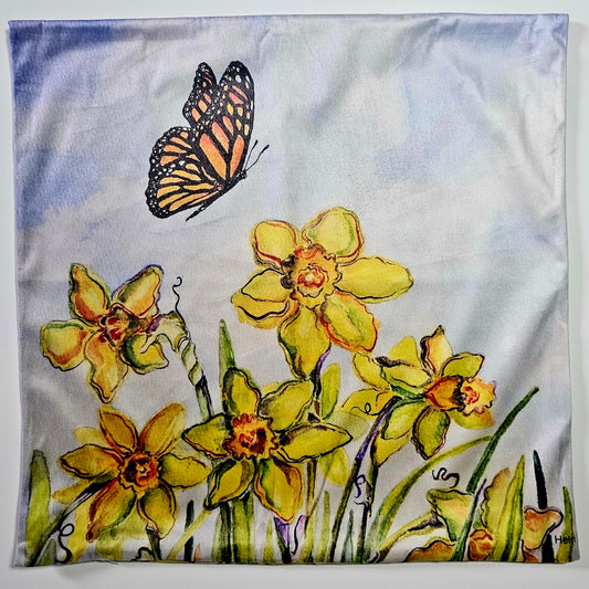 Decorative fabric with yellow flowers and a butterfly on a white and sky blue background