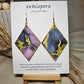 Diamond Flow Large Statement Hand Painted and collage embellished Diamond Shape Wood Earrings. Organic shapes and metallic lines,. Blues, purples and gold. Painted gold metallic edges. Back is in similar color and design. Ultra light weight. Enameled for durability. 2 3/4" in size. 14kg over sterling silver findings and hangs 3" in length