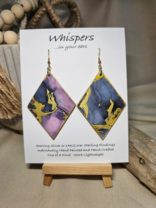 Diamond Flow Large Statement Hand Painted and collage embellished Diamond Shape Wood Earrings. Organic shapes and metallic lines,. Blues, purples and gold. Painted gold metallic edges. Back is in similar color and design. Ultra light weight. Enameled for durability. 2 3/4" in size. 14kg over sterling silver findings and hangs 3" in length