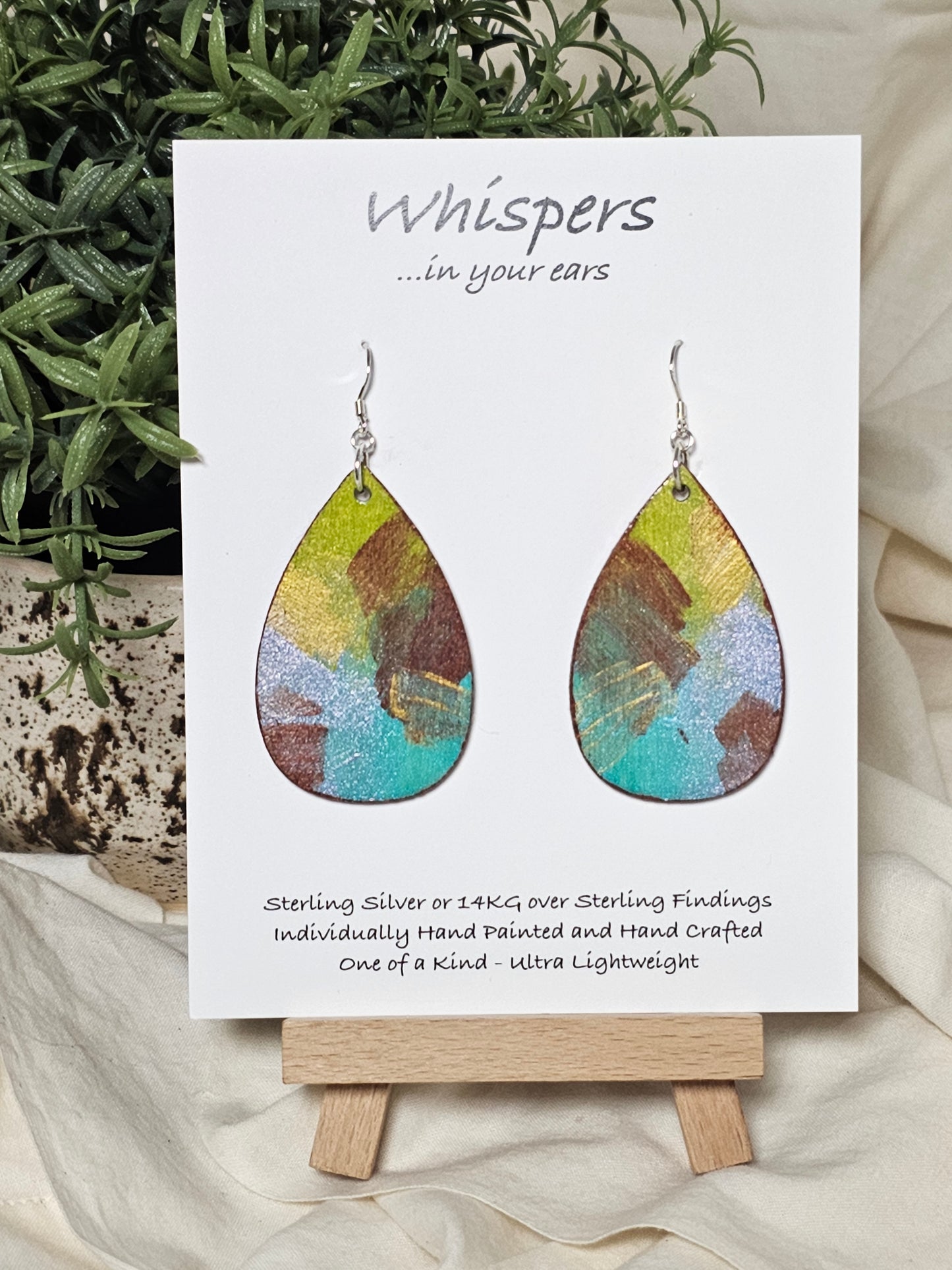 Iridescent Swipe Hand Painted Wood Earrings. 2" Wood Teardrop, painted with iridescent acrylics, Back is painted to match. Enameled for durability. Sterling silver findings. Hangs 2 1/4" in length