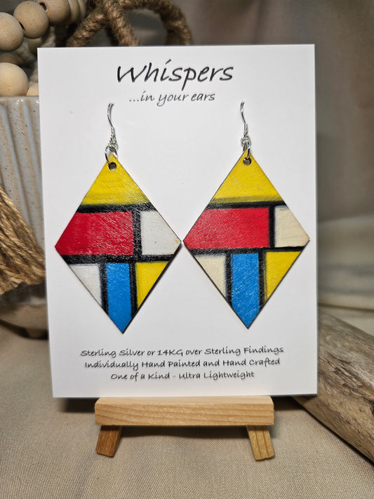 Mondrian Inspired Large Statement Hand Painted Diamond Shape Wood Earrings. Colorful rectangular shapes and black lines,. Blues red, black and white Painted black edges. Back is in similar color and design. Ultra light weight. Enameled for durability. 2 3/4" in size. Sterling silver findings and hangs 3" in length
