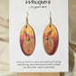 Pumpkin Glow Hand Painted Wood Earrings. Ombre background orange and red. Back painted in similar colors. Enameled for durability. 2" Elongated wood oval. 14kg over sterling silver findings and hangs 2 1/4"