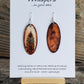 Hand painted watercolor ultra lightweight paper earrings. Brown and teal lone feather. Faux wood background, accented with painted burlwood detailed edge.  Back is painted brown. Elongated oval in shape. Sterling silver findings. Hangs 2 1/8" in Length