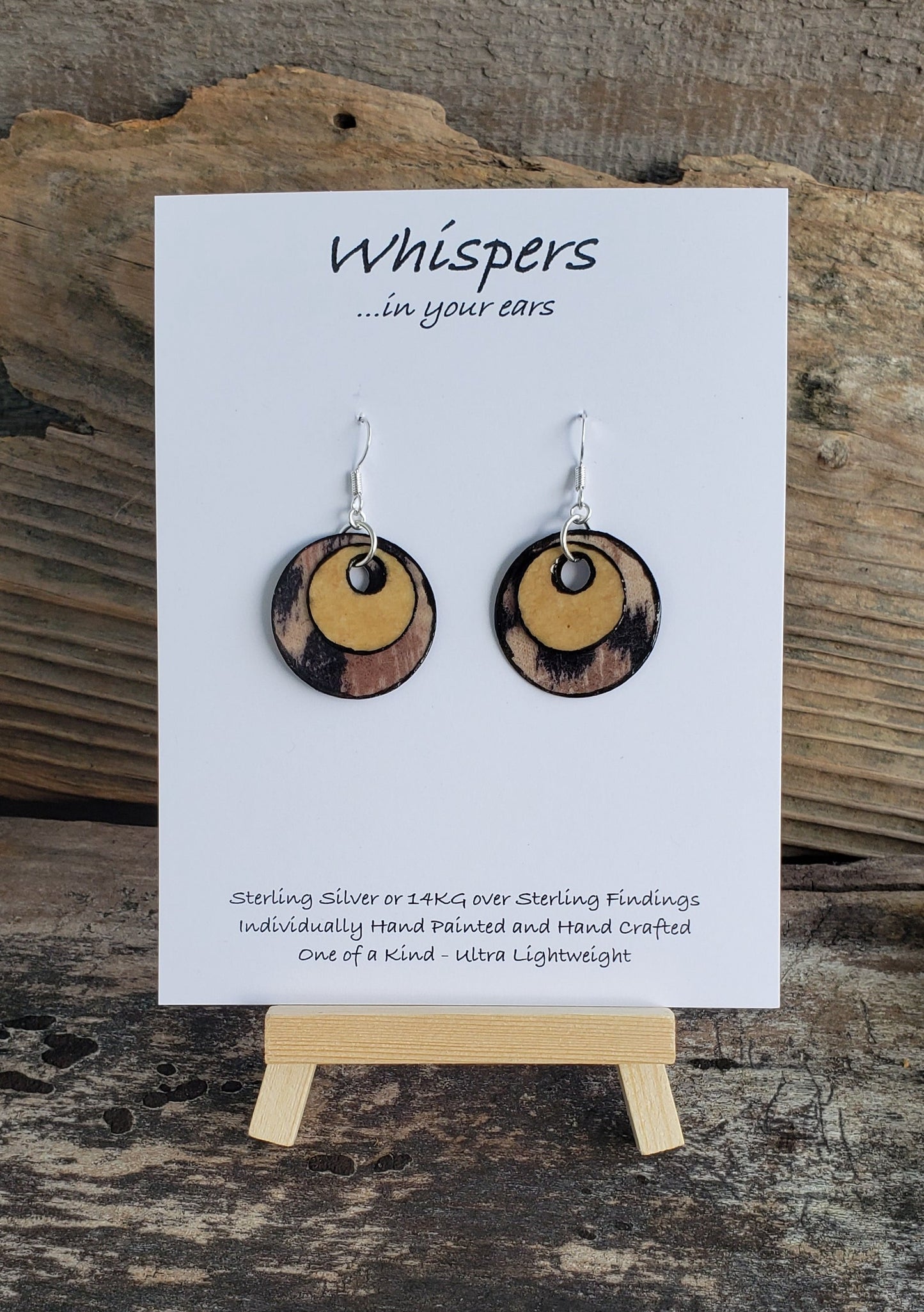 Hand crafted ultra lightweight paper earrings. Mixed Media Cheetah Print and Tan Double Layer.  Back is similar print.  Circular in shape. Sterling silver findings. Hangs 1 1/4" in Length