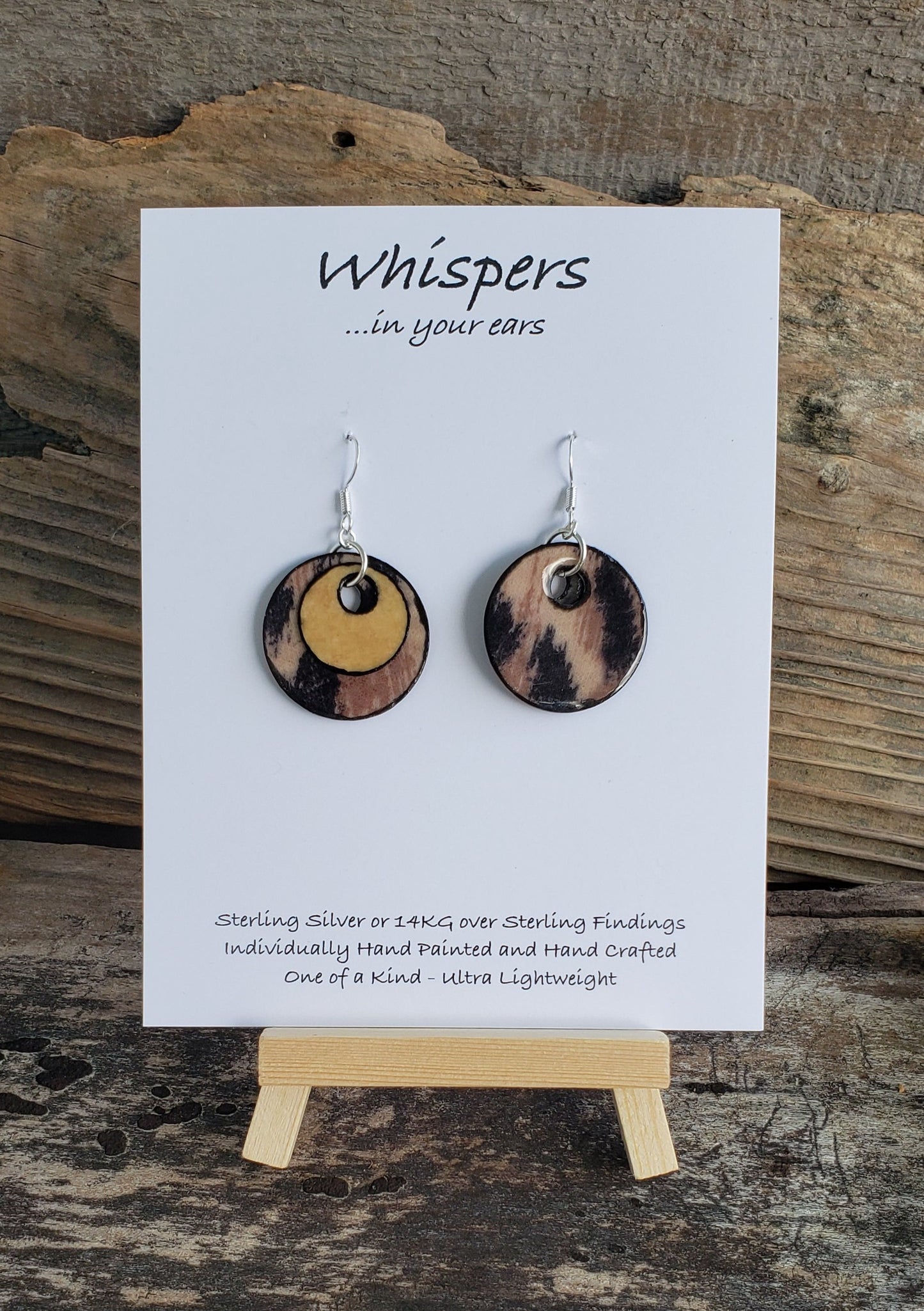 Hand crafted ultra lightweight paper earrings. Mixed Media Cheetah Print and Tan Double Layer.  Back is similar print.  Circular in shape. Sterling silver findings. Hangs 1 1/4" in Length