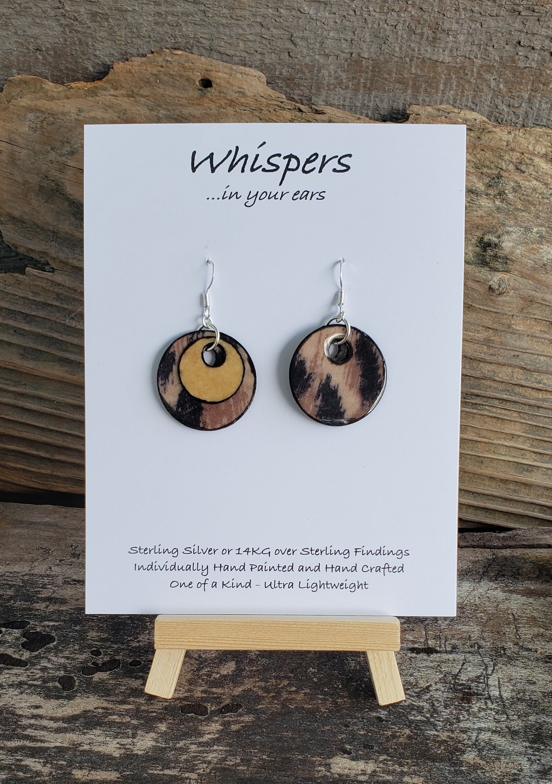 Hand crafted ultra lightweight paper earrings. Mixed Media Cheetah Print and Tan Double Layer.  Back is similar print.  Circular in shape. Sterling silver findings. Hangs 1 1/4" in Length