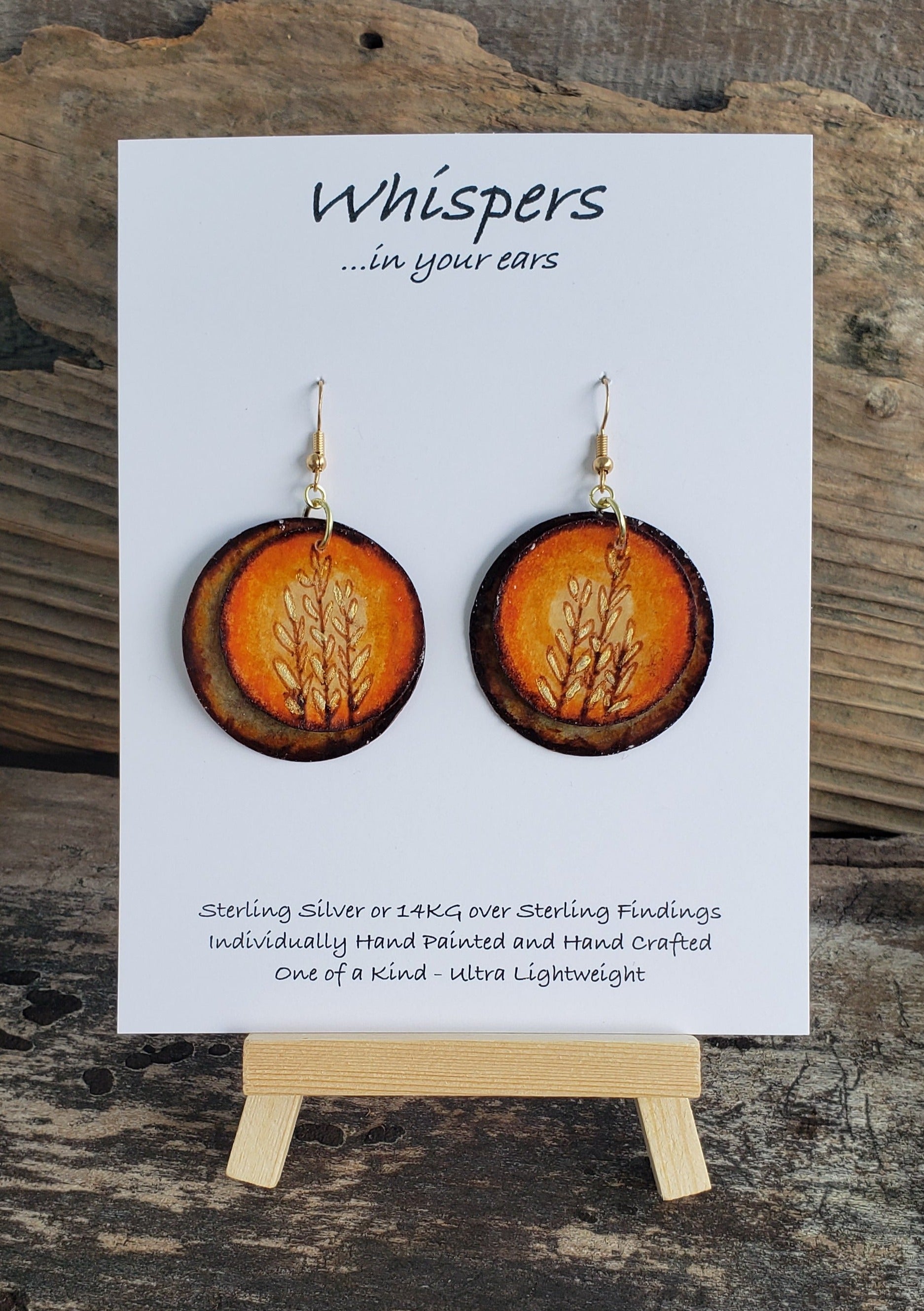 Hand painted watercolor ultra lightweight paper earrings. Goldenrod in Sun nature scape. Double layer. Back is textured brown. Circular in shape. 14kg over silver findings. Hangs 1 3/4" in Length