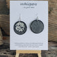 Hand painted ultra lightweight paper earrings. Mini cow print. Double Layer Iridescent Silver Textured Paper. Black painted edges. Back is silver. Circular in shape. Sterling silver findings. Hangs 1 3/4" in Length