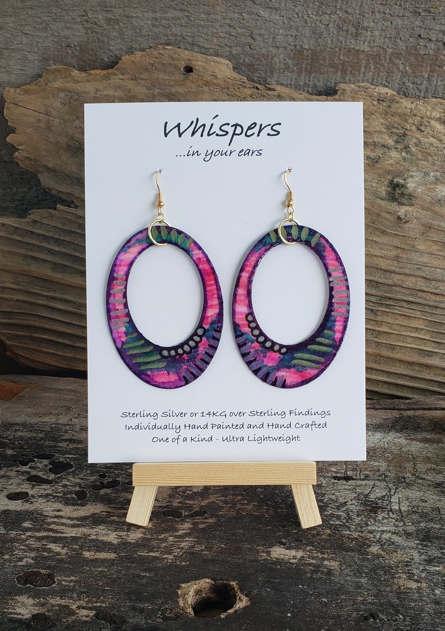 Hand painted watercolor ultra lightweight paper earrings Bright pink and purple with gold and silver striped dot accents. Large statement oval in shape with oval cut out. Back painted edge. Back is painted in pink. 14kg over silver findings. Hangs 2 3/4" in Length