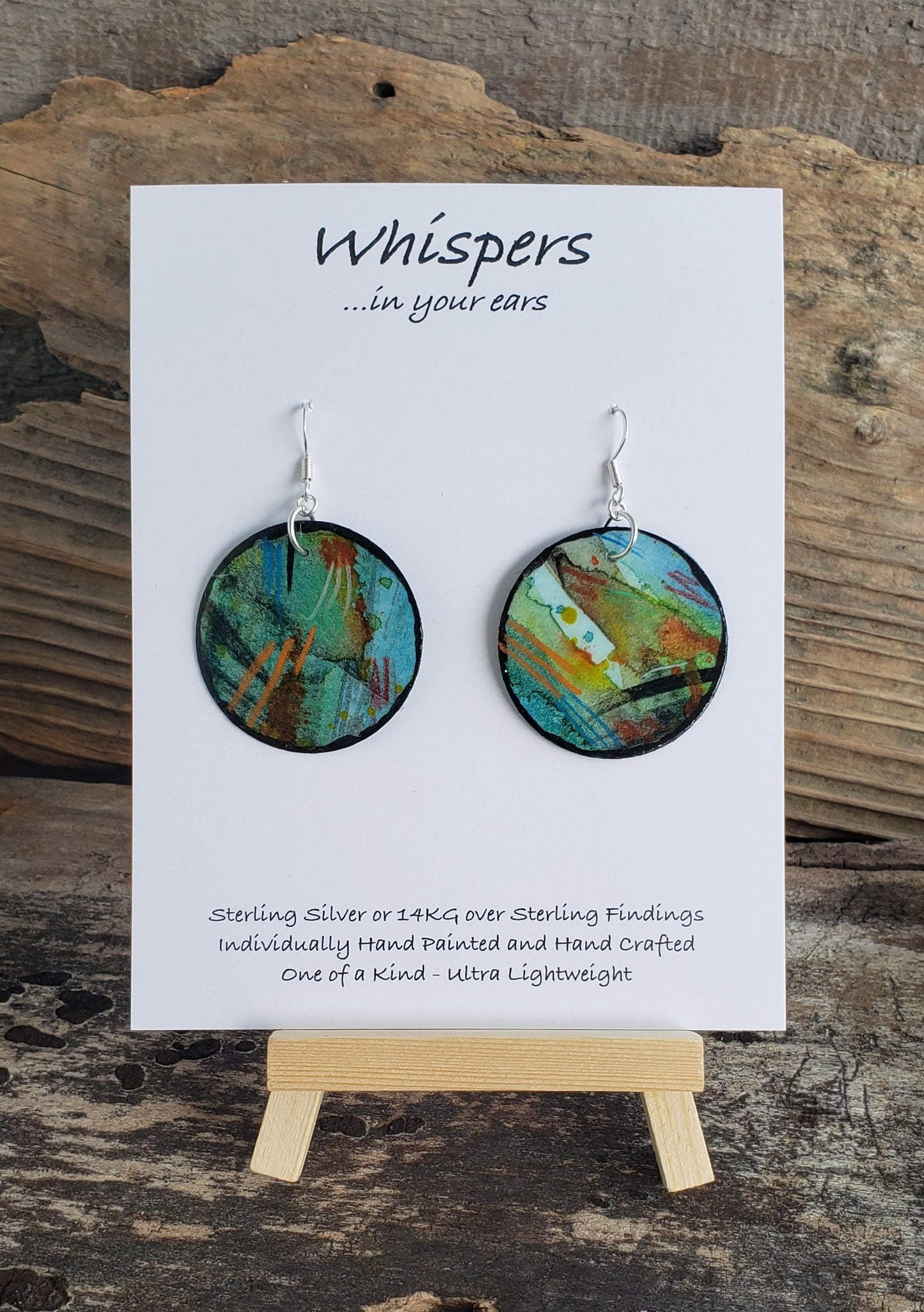 Hand painted watercolor ultra lightweight paper earrings. Blues and lime green orange and black. Mixed media pencil acrylic.  Black painted edges. Back is painted in similar colors. Circular in shape. Hangs 2 1/4" in Length
