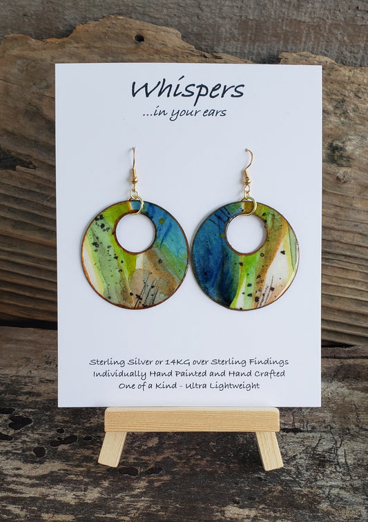 Hand painted watercolor ultra lightweight paper earrings. Blue, lime green and taupe with copper detail painted edge. Back is painted copper. Large circular in shape with circular cut out. 14kg over silver findings.  Hangs 2 1/4" in Length